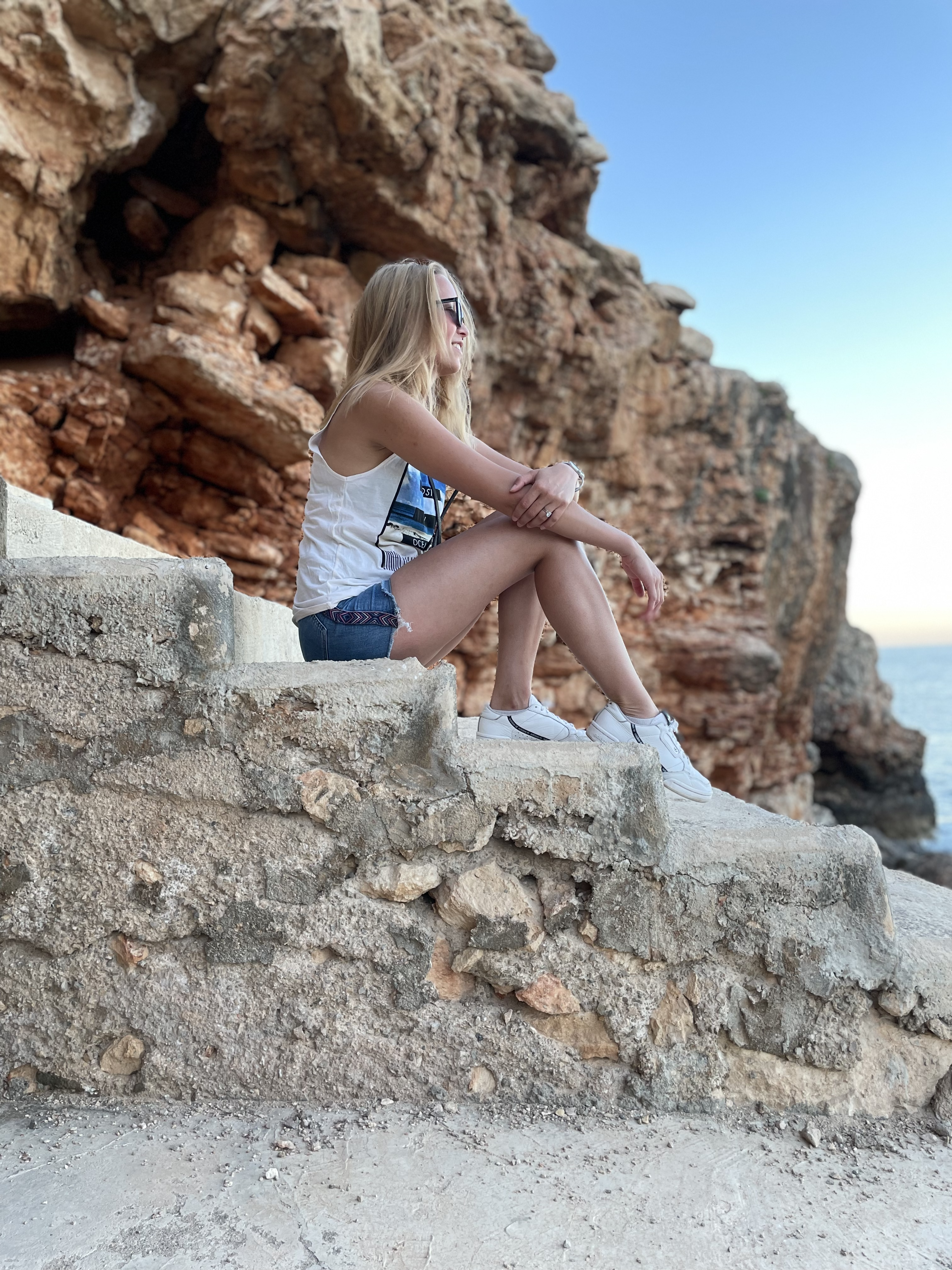 sitting on a cliff in Spain